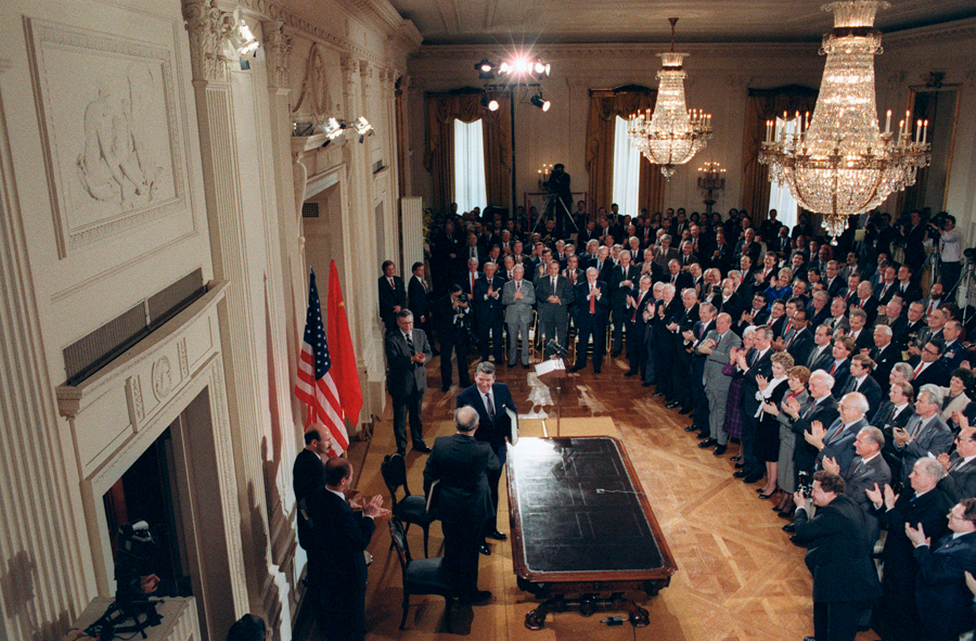 Soviet leader Mikhail Gorbachev and U.S. President Ronald Reagan shake hands after signed the Intermediate-Range Nuclear Forces Treaty at the White House December 8, 1987. (Photo credit: Don Emmert/AFP/Getty Images)