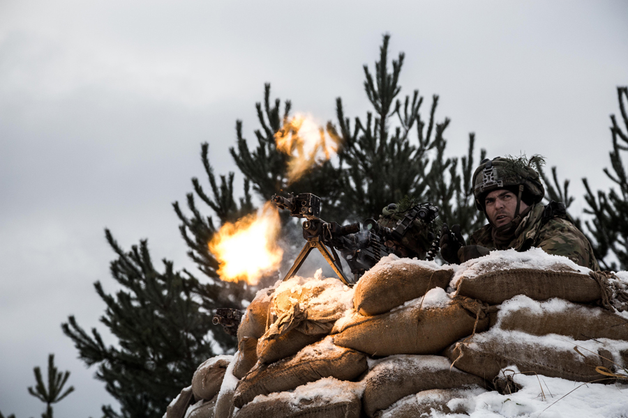 A U.S. soldier fires December 1, 2016, during the North Atlantic Treaty Organization training exercise hosted by Lithuania known as Iron Sword that involved almost 4,000 soldiers from 11 NATO countries. NATO’s decision to rotate four multinational combat battalions through Estonia, Latvia, Lithuania, and Poland has drawn Russian complaints that such activities constitute a new security threat that will require countermeasures. (Photo credit: NATO)