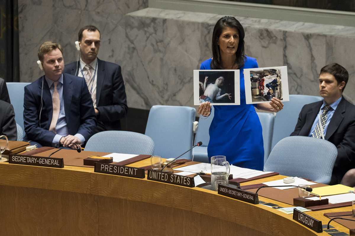 U.S. Ambassador to the United Nations Nikki Haley displays photos of victims of the Syrian government’s April 4 chemical weapons as she speaks during an emergency Security Council session April 5. Sarin nerve agent reportedly killed many as 100 people, including many children. Credit: Drew Angerer/Getty Images