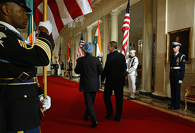 Indian Prime Minister Manmohan Singh (left) and U.S. President George W. Bush walk together after announcing a new policy on U.S.-Indian nuclear relations during a press conference at the White House on July 18, 2005. (Jim Watson/AFP/Getty Images)