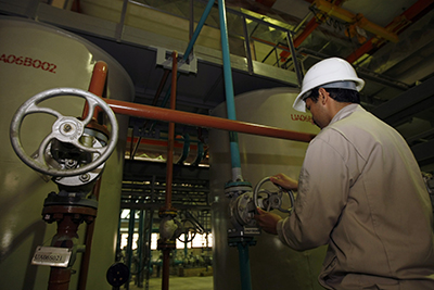 An Iranian technician works at the water-purifying facility in the Bushehr nuclear power plant on February 25, 2009. (Behrouz Mehri/AFP/Getty Images)