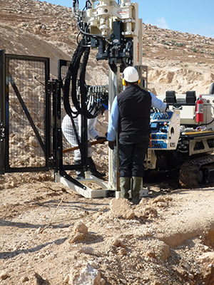 Members of the inspection team use a geoprobe to poke holes in the earth for sampling of subsoil gases as part of the exercise’s simulated on-site inspection on November 25, 2014. (Courtesy of Jenifer Mackby)