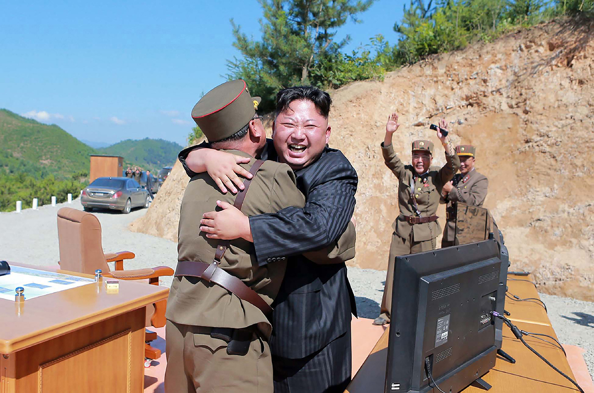 North Korean leader Kim Jong Un celebrates the successful July 4 test of the Hwasong-14 intercontinental ballistic missile in a photo from the official Korean Central News Agency. (Photo credit: Stringer/AFP/Getty Images)