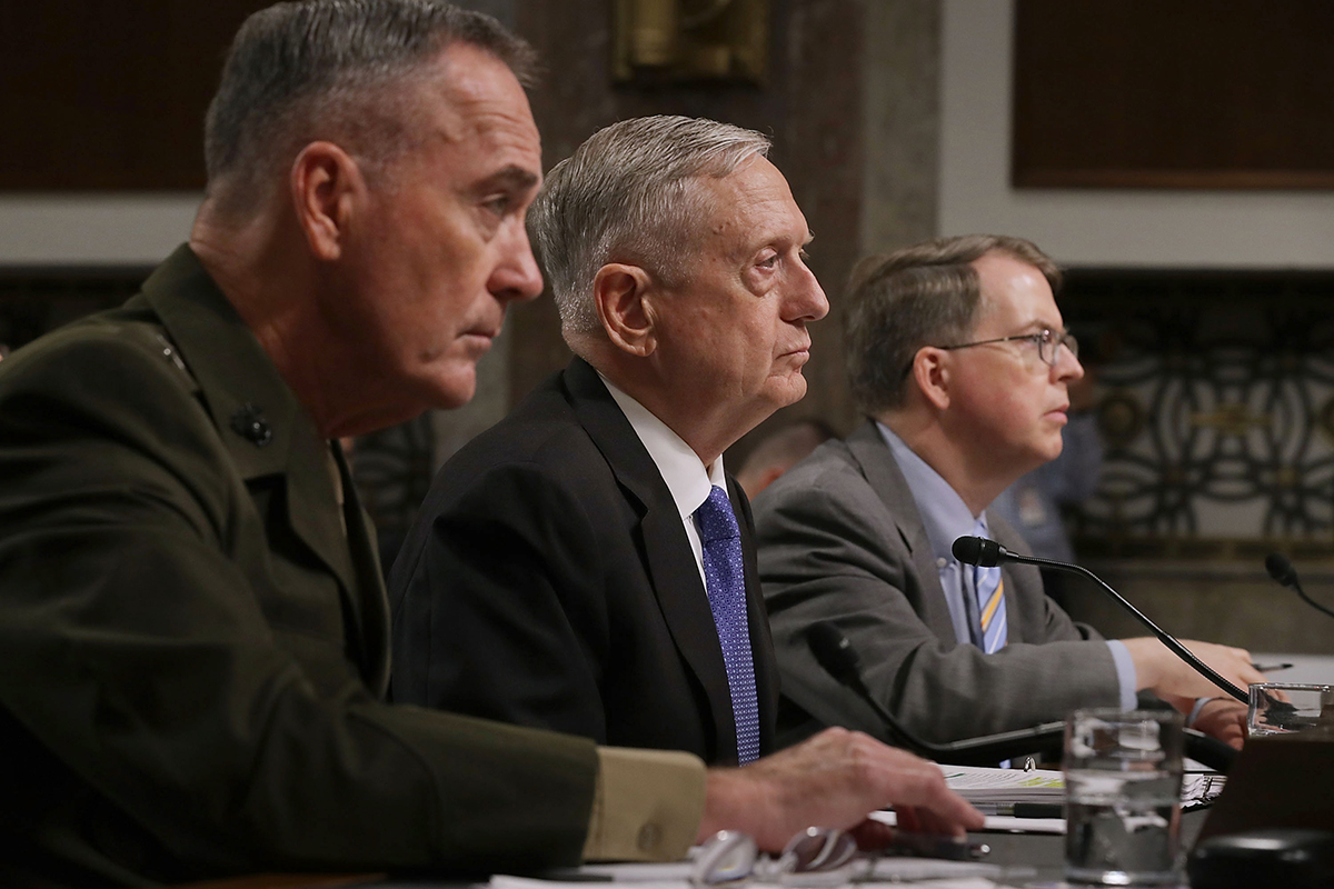 Defense Secretary James Mattis, flanked by Chairman of the Joint Chiefs of Staff Gen. Joseph Dunford (left) and Under­secretary of Defense (Comptroller) David Norquist, testifies June 13 at a Senate Armed Services Committee hearing on the administration’s defense budget request. (Photo credit: Chip Somodevilla/Getty Images)