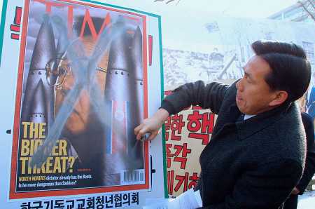 A South Korean protester sprays paint on a portrait of then-North Korean leader Kim Jong Il during a rally January 23, 2003 in Seoul protesting North Korea’s nuclear weapons program and its withdrawal from the nuclear Nonproliferation Treaty. Fifteen years later, North Korea, led by Kim Jong Un, has an arsenal of nuclear weapons in defiance of world powers. (Photo: Chung Sung-Jun/Getty Images)