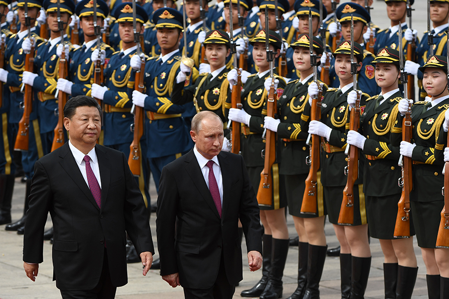 Chinese President Xi Jinping (left) and Russian President Vladimir Putin review a military honor guard during Putin's visit to Beijing on June 8, 2018. The two leaders appear unlikely to participate in a U.S. initiative to identify barriers to nuclear disarmament. (Photo: Greg Baker/AFP/Getty Images)
