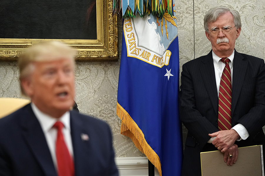 National Security Advisor John Bolton (right) listens to U.S. President Donald Trump at a July 18 White House meeting. Recent Bolton comments have created doubt that the United States will seek to extend New START. (Photo: Chip Somodevilla/Getty Images)