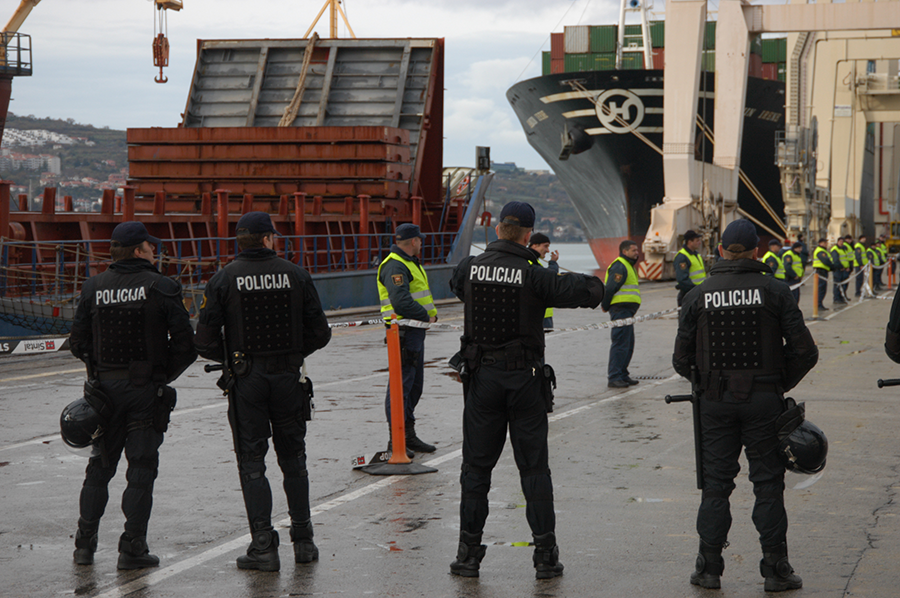 Slovenian police protect a ship-loading operation at the port of Koper on Nov. 21, 2010. Highly enriched uranium removed from a Serbian research reactor had been transferred to the port on its way to Russia for disposition. Under the nuclear security summit process, 13 nations eliminated their holdings of highly enriched uranium and separated plutonium. (Photo: Greg Webb/IAEA)