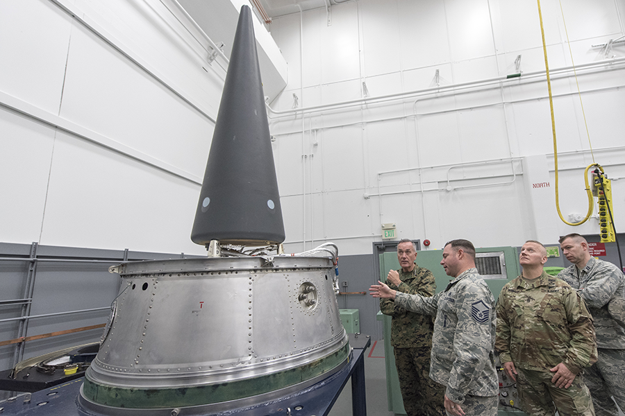 Marine Gen. Joseph F. Dunford Jr. (left), then chairman of the Joint Chiefs of Staff, watches a demonstration of the transporters used for Minuteman III ICBMs at Minot Air Force Base, N.D., in 2016. The Air Force is planning to replace all of its W87 ICBM warheads with new W87-1 warheads that will require newly produced plutonium pits. (Photo: Dominique Pineiro/U.S. Navy/Joint Chiefs of Staff)