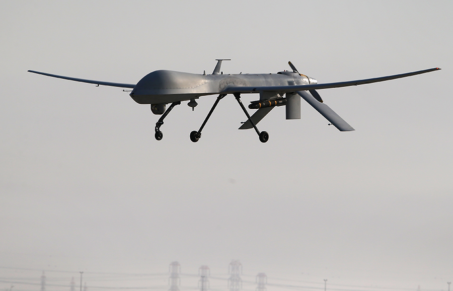A U.S. Air Force Predator drone armed with a Hellfire missile lands at a secret air base after flying a mission in the Persian Gulf region in January 2016. The Trump administration has announced a new interpretation of international export control guidelines to allow more U.S. sales of such weapons. (Photo: John Moore/Getty Images)