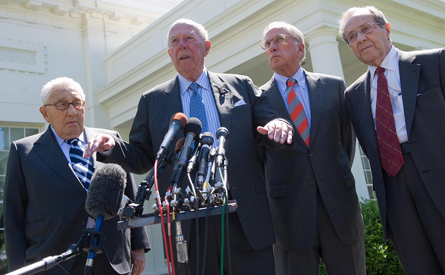 Former U.S. Secretary of State Henry Kissinger (L) stands alongside former Secretary of Defense William Perry (R) and former Senator Sam Nunn (2nd R) as former U.S. Secretary of State George Shultz (2nd L) speaks to the media outside the West Wing of the White House in Washington on May 19, 2009, after meeting with U.S. President Barack Obama to discuss key priorities in U.S. nuclear nonproliferation policy.  (Photo: Saul Loeb/AFP via Getty Images)