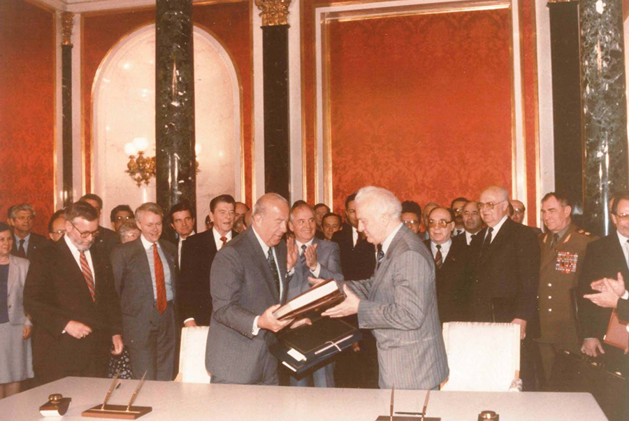 U.S. Secretary of State George Shultz (L) and Soviet Foreign Minister Eduard Shevardnadze signed the Joint Verification Experiment Agreement in Moscow in 1988, providing the first opportunity for scientists from the two nuclear superpowers to cooperate on measuring nuclear test yields. (Photo by Stanford University)
