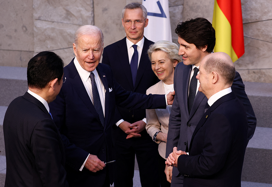 World leaders confer March 24 on the sidelines of meetings of NATO and the G7 in Brussels to discuss the Russian war in Ukraine, L to R: Japanese Prime Minister Fumio Kishida, U.S. President Joe Biden, NATO Secretary General Jens Stoltenberg, European Commission President Ursula von der Leyen, Canadian Prime Minister Justin Trudeau and German Chancellor Olaf Scholz.  (Photo by Henry Nicholls - Pool/Getty Images)