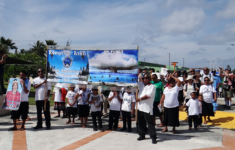 Islanders from Rongelap Atoll in The Marshall Islands, which was damaged by U.S. nuclear testing, march while holding banners marking the 60th anniversary of the Bravo hydrogen bomb test at Bikini Atoll in Majuro on March 1, 2014. The Marshallese have long called on the United States to resolve the 