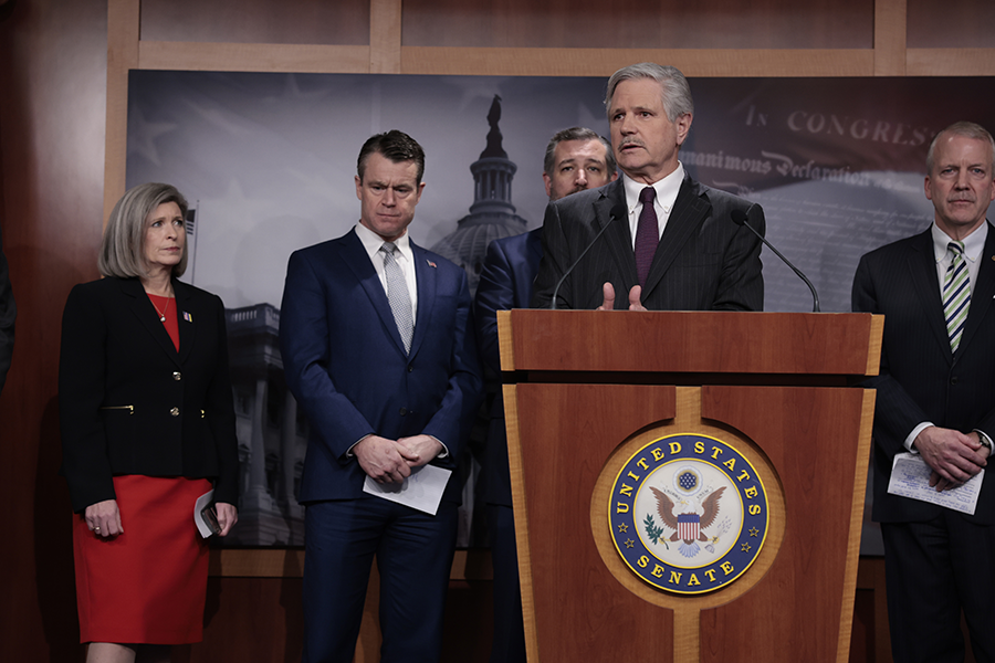 Senator John Hoeven (ND), at podium, and other Republican senators hold press conference at the U.S. Capitol in March to discuss their objections to negotiations aimed at restoring Iranian and U.S. compliance with the 2015 Iran nuclear deal.  (Photo by Anna Moneymaker/Getty Images)