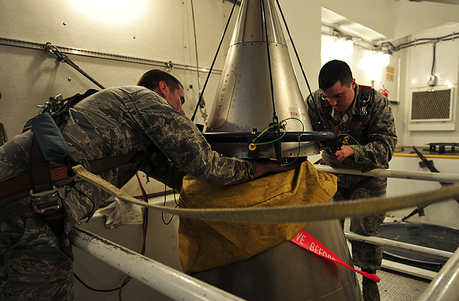 U.S. Air Force Staff Sergeant Wesley Baptiste (L) and Airman Daniel Peryer perform a “simulated missile reduction” in accordance with the New Strategic Arms Reduction Treaty at Minot Air Force Base, North Dakota, in 2011. Such inspections, and the treaty itself, are now at risk because of Russia's failure to resume the inspections amid its war on Ukraine.  (Photo credit: U.S. Air Force/Airman 1st Class Desiree Esposito)