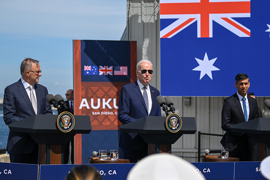 U.S. President Joe Biden (C) delivers remarks on the Australia-United Kingdom-United States (AUKUS) defense partnership along with UK Prime Minister Rishi Sunak (R) and Australian Prime Minister Anthony Albanese at Naval Base Point Loma in San Diego in March. (Photo by Tayfun Coskun/Anadolu Agency via Getty Images)