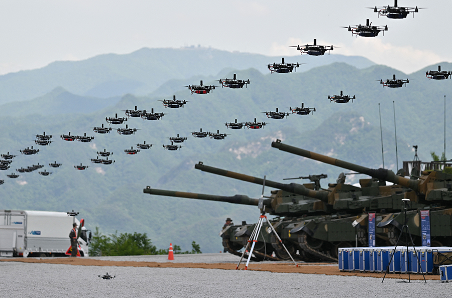 South Korea’s military drones fly in formation during a joint military drill with the United States in Pocheon in May.  (Photo by Yelim Lee/AFP via Getty Images)