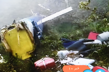 Photo taken from Iranian state-run IRIB TV on May 20 shows the wreckage of the crashed helicopter in which Iranian President Ebrahim Raisi, Foreign Minister Hossein Amirabdollahian and other officials died some 670 km from Tehran. Raisi’s death has created new uncertainty for Iran and the region. (Photo by Shadati/Xinhua via Getty Images)