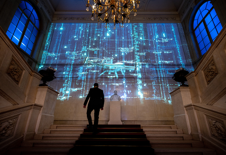Images of autonomous weapons systems are projected onto a wall during a conference titled “Humanity at the Crossroads: Autonomous Weapons Systems and the Challenge of Regulation” at the Hofburg palace in Vienna, April 30. The event focused on regulating these systems. (Photo by Joe Klamar/AFP via Getty Images)