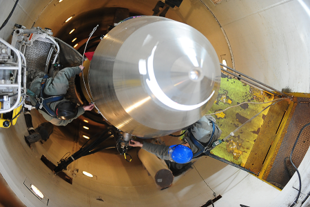 U.S. Air Force technicians perform maintenance on a Minuteman III intercontinental ballistic missile (ICBM). Plans to replace the Minuteman missile with the Sentinel ICBM could be in trouble because of the Sentinel’s rising costs and production delays.  (U.S. Air Force Photo by Airman 1st Class Kristoffer Kaubisch)