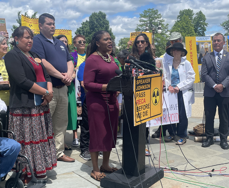 U.S. Rep. Cori Bush (D-Mo.), at podium, other Congress members, and activists advocate in May for extension and expansion of the Radiation Exposure Compensation Act, which has aided people harmed by U.S. nuclear testing. (Photo by Chris Rostampour)