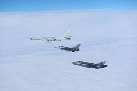 A Chinese H-6 bomber (Top) is trailed by U.S. fighter aircraft. NORAD reported on July 24 that six U.S. aircraft intercepted two Chinese H-6 bombers and two Russian TU-95 bombers operating in the Alaska Air Defense Identification Zone. (Photo courtesy of NORAD)