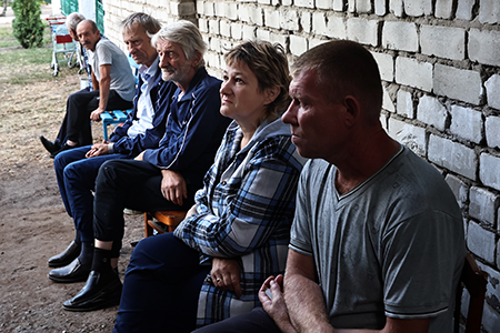 Civilian residents sit near a bomb shelter in the Kursk region of Russia on August 16,  10 days after Ukrainian military forces crossed the Russian-Ukrainian border near the city of Sudzha and began to advance deep into Russian territory. (Photo by Yan Dobronosov/Global Images Ukraine via Getty Images)