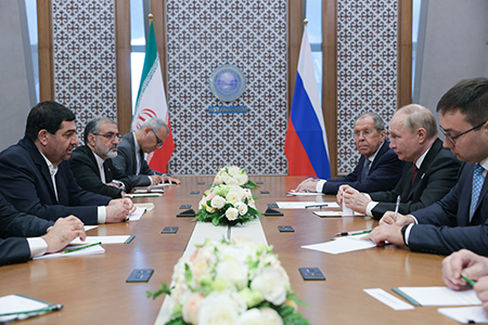 Russian President Vladimir Putin (C, Right) meets with Iran’s interim President Mohammad Mokhber (Opposite) on the sidelines of the Shanghai Cooperation Organization meeting in Astana on July 4. The two countries have grown closer in recent years. (Photo by Gavrill Grigorov/POOL/AFP via Getty Images)