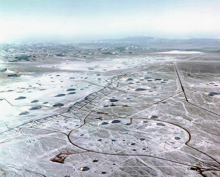 These subsidence craters in the Yucca Flat formed after U.S. nuclear weapons were detonated underground at the Nevada Test Site between 1951 and 1992.  (Photo by Galerie Bilderwelt/Getty Images)