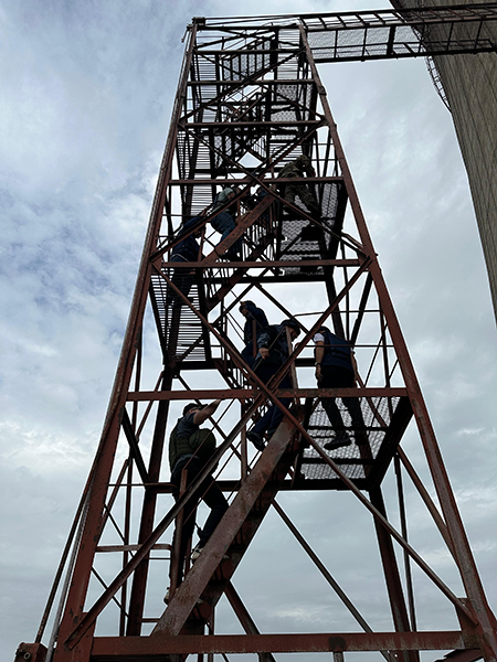 Director-General Rafael Mariano Grossi and his team from the International Atomic Energy Agency (IAEA) tour the damaged cooling tower at Ukraine’s Zaporizhzhia Nuclear Power Plant on Sept. 4. (Photo by Diego Candano Laris / IAEA)