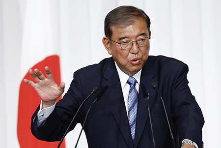 Japanese Prime Minister Shigeru Ishiba, shown at a press conference on Oct. 28, has stirred controversy with a proposal for an Asian version of NATO that could include nuclear sharing. (Photo by Kim Kyung-Hoon / Pool/Anadolu via Getty Images)