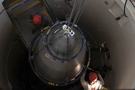 Technicians at Francis E. Warren Air Force Base in Wyoming work on maintaining the Minuteman III intercontinental ballistic missile, part of the U.S. arsenal being modernized at a projected cost of $1.7 trillion over the next 30 years. (U.S. Air Force photo by Senior Airman Abbigayle Williams)