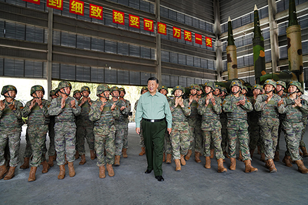 Chinese President Xi Jinping (C) visits soldiers of the Chinese army Rocket Force, which manages the state’s arsenal of nuclear and conventional land-based ballistic, hypersonic, and cruise missiles, on a training exercise in October. (Photo by Li Gang/Xinhua via Getty Images)