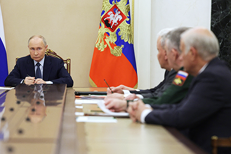 In this pool photograph distributed by the Russian state agency Sputnik, Russia’s President Vladimir Putin meets with military chiefs in Moscow on November 22, 2024. Putin said that Moscow would carry out more tests of the hypersonic Oreshnik ballistic missile in “combat conditions,” a day after firing one on Ukraine. (Photo by Gavriil Grigorov/POOL/AFP via Getty Images)