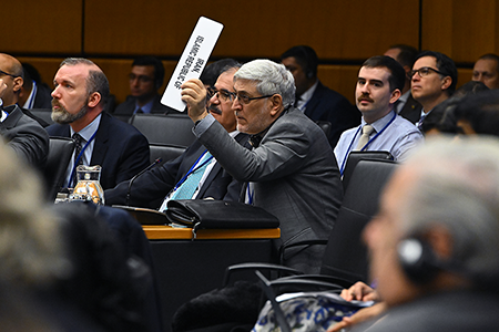 Mohsen Naziri Asl, Iran’s ambassador to the International Atomic Energy Agency (IAEA), seeks to speak during a Nov. 20-21 meeting in Vienna at which the IAEA Board of Governors censured Iran for failing to cooperate with the agency in its years-long investigation into Iran’s nuclear activities. (Photo by Dean Calma / IAEA)