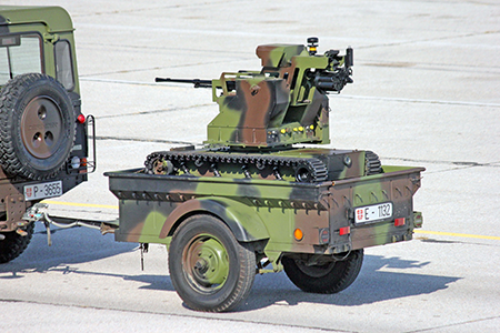 A “Miloš” tracked combat robot, an unmanned ground vehicle that can be armed with machine guns, M11 grenade launchers and other armaments, being towed in 2019 by a Serbian Land Rover. Serbia, among many countries developing or acquiring lethal autonomous weapons, presented its first unmanned ground vehicle in 2009. (Photo by Srđan Popović via Wikipedia, available under public license: creativecommons.org/licenses/by-sa/4.0/)