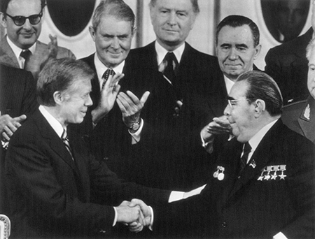 In June 1979, U.S. President Jimmy Carter (L) and Soviet leader Leonid Brezhnev signed the SALT II Treaty at the Hofburg Palace in Vienna. The treaty came under unrelenting criticism in the United States and after the Soviets invaded Afghanistan, Carter withdrew it from Senate consideration in 1980. (Photo by Bettman Archives via Getty Images)