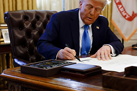 U.S. President Donald Trump signs a national security presidential memorandum at the White House on Feb. 4 “reimposing maximum pressure on Iran.” (Photo by Anna Moneymaker/Getty Images)