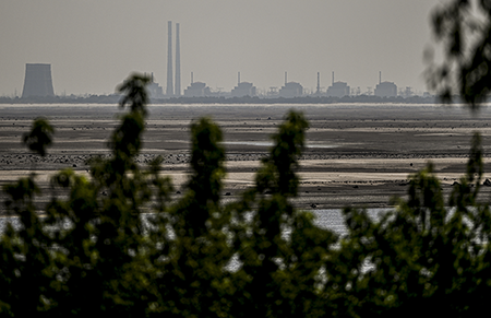 The Russian operator of the Zaporizhzhia Nuclear Power Plant, seen from Nikopol in 2023, is now under U.S. sanctions.  (Photo by Ercin Erturk/Anadolu Agency via Getty Images) 