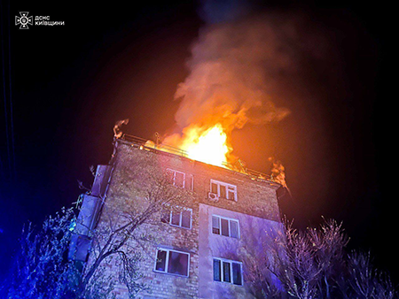 Flames rise from a fire caused by the massive Russian shelling on the Buchansky district of Kyiv April 24. Russia’s illegal war on Ukraine has poisoned international relations and undermined cooperation, including on nuclear arms control and nonproliferation efforts. (Photo by Ukrainian State Emergency Service / Handout /Anadolu via Getty Images)