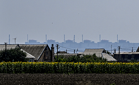 Zaporizhzhia Nuclear Power Plant is seen from Nikopol, Ukraine, 7 kilometers away. Russia took control of the complex when it invaded Ukraine in 2022 and now Ukraine is objecting to Russian plans to restart several of the reactor units. (Photo by Ercin Erturk/Anadolu Agency via Getty Images)