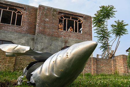 The wreckage of an unidentified aircraft lays on the ground in Kashmir. India launched airstrikes on Pakistan and Pakistan-administered Kashmir May 7 after a terrorist attack April 22 killed 26 people in the Kashmiri town of Pahalgam. The attack, which India blamed on Pakistan, triggered a three-week crisis of expansive air strikes between the nuclear rivals. (Photo by Basit Zargar/Middle east images/AFP via Getty Images)