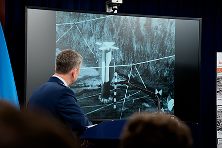 U.S. Chairman of the Joint Chiefs of Staff Air Force Gen. Dan Caine participates in a press conference June 26 after the United States bombed three Iranian nuclear facilities. The screen shows a video of a bombing test of the GBU-57A/B Massive Ordnance Penetrator, which was used in the attack on the Iranian Fordow uranium enrichment plant. (Photo by Andrew Harnik/Getty Images)