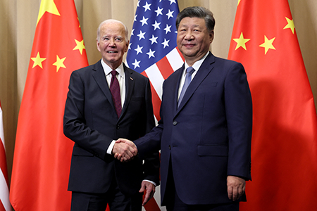 U.S. President Joe Biden (L), and Chinese President Xi Jinping, meeting on the sidelines of the Asia-Pacific Economic Cooperation summit in Lima in 2024, agreed that artificial intelligence must never supplant human judgment in the authorization or execution of nuclear weapon launches. (Photo by Leah Millis/POOL/AFP via Getty Images)