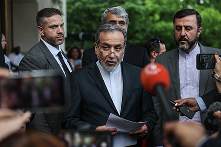 Iranian Foreign Minister Abbas Araghchi (C) speaks to media after his June 20 meeting with the E3 group of European ministers in Geneva. The two sides met again in August but failed to reach an agreement on extending the mechanism for restoring UN sanctions, set to expire in October, in exchange for Iran taking steps to increase transparency over its nuclear program. (Photo by Sedat Suna/Getty Images)