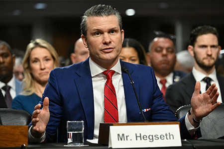 U.S. Defense Secretary Pete Hegseth, seen testifying at his Senate confirmation hearing in January, is reforming how the Pentagon acquires weapons systems by loosening restrictions on defense contractors and emphasizing speed over other requirements, promising a transformational improvement. (Photo by Saul Loeb/AFP via Getty Images)