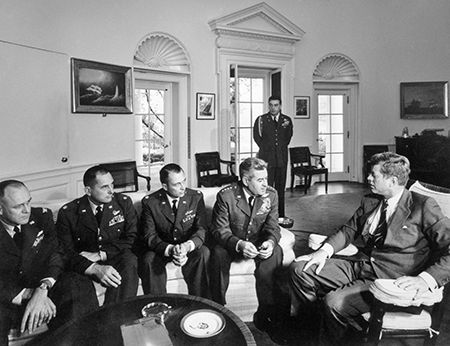 President John Kennedy (R) meets with military and political advisers in October 1962 during the Cuban missile crisis, which triggered the first arms control agreement with the Soviet Union, the hotline agreement. (Photo by Charles Phelps Cushing/ClassicStock/Getty Images)