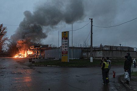 European states are pursing medium-range missiles in response to rising fears of conflict with Russia. Ukrainians watch a petrol station in flames after a Russian drone attack in Druzhkivka in December. (Photo by Diego Herrera Carcedo/Anadolu via Getty Images)