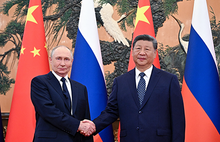 Russian President Vladimir Putin (L) meets Chinese President Xi Jinping at The Great Hall of the People in Beijing on September 2, 2025. Some U.S. analysts see their growing partnership as a coordinated threat but contributor Georgi Ivanov disagrees. (Photo by Sergey Bobylev/POOL/AFP via Getty Images)